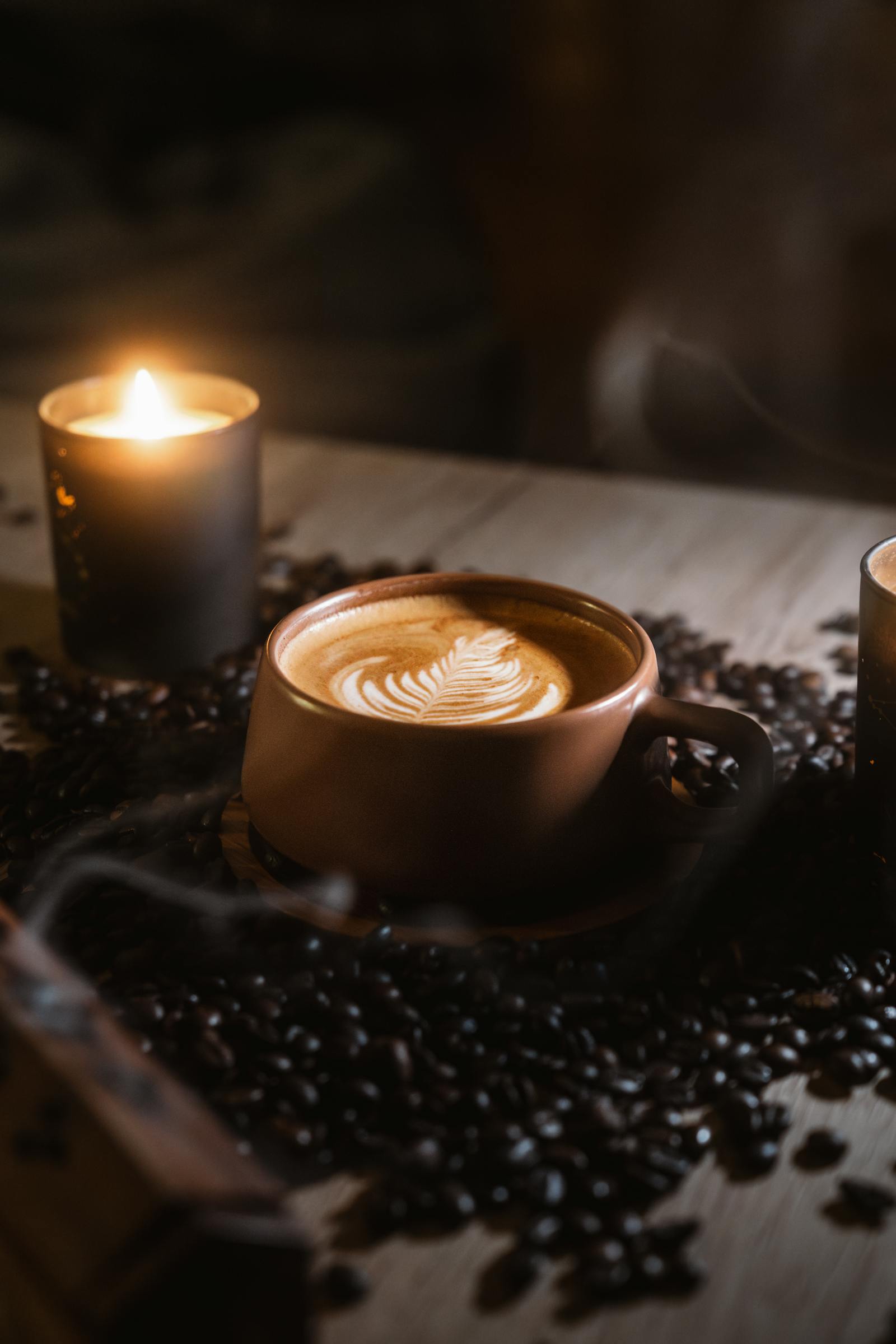 cozy cafe setting with latte art and candles