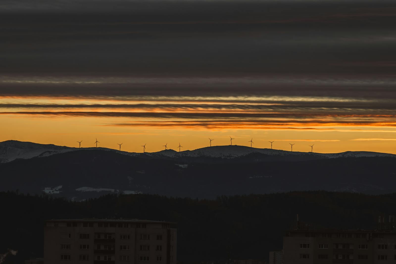 sunset over windmills in graz austria