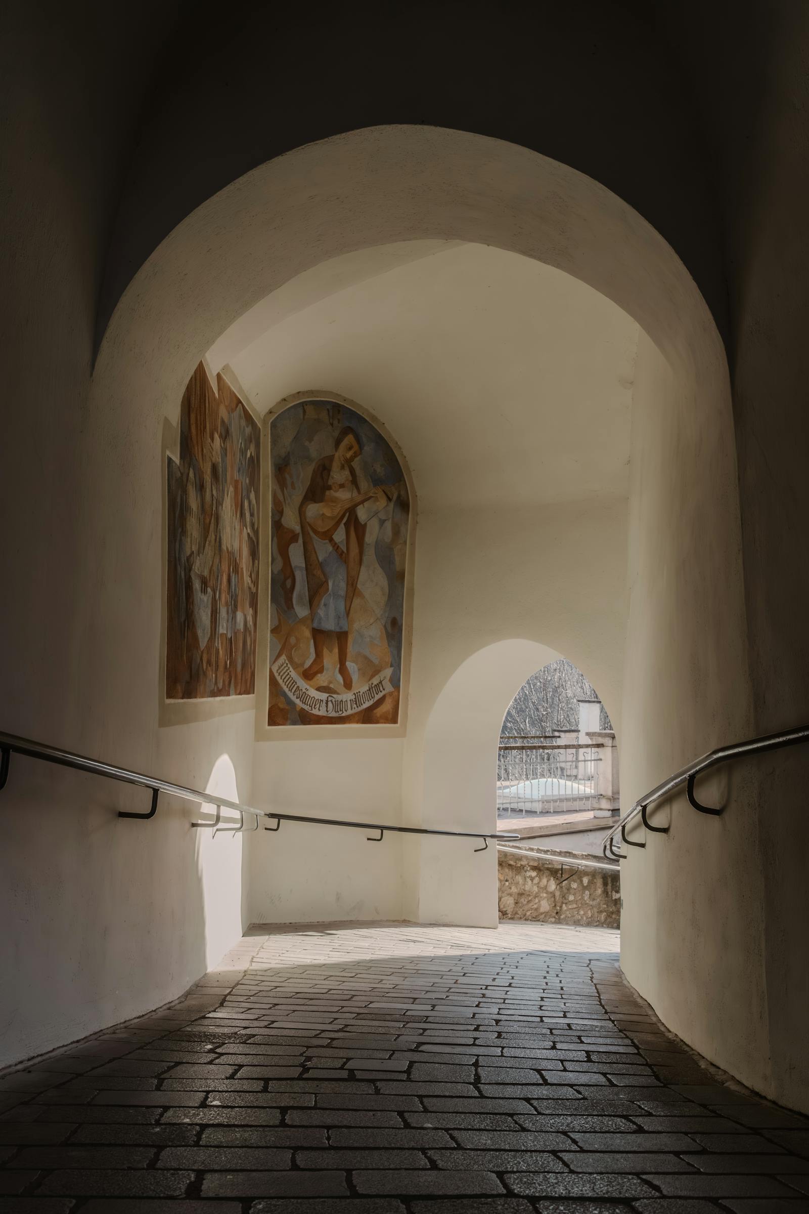 historic archway with murals in austria