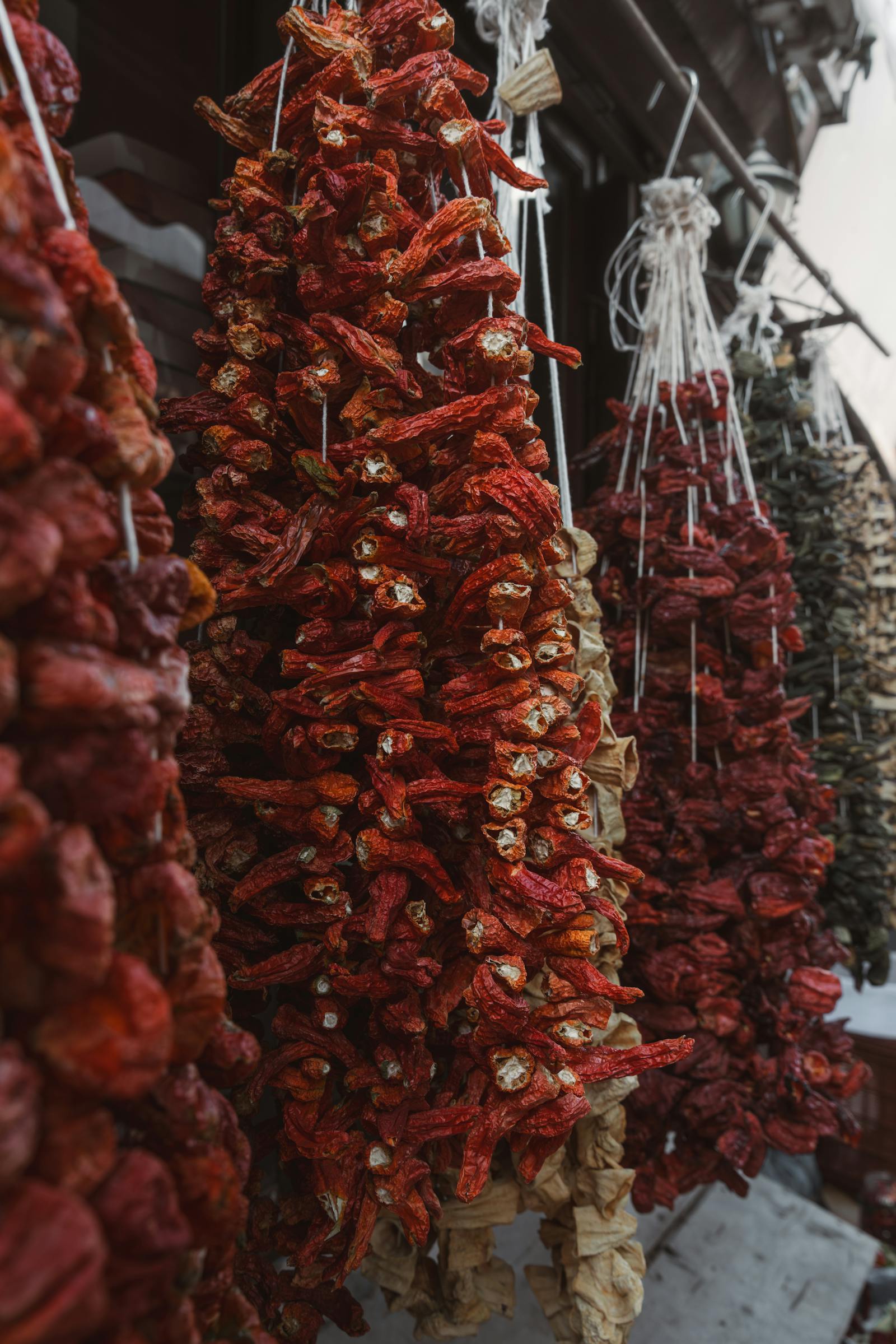 Vivid strings of dried peppers displayed at a traditional market in Beypazarı, Ankara, Türkiye.