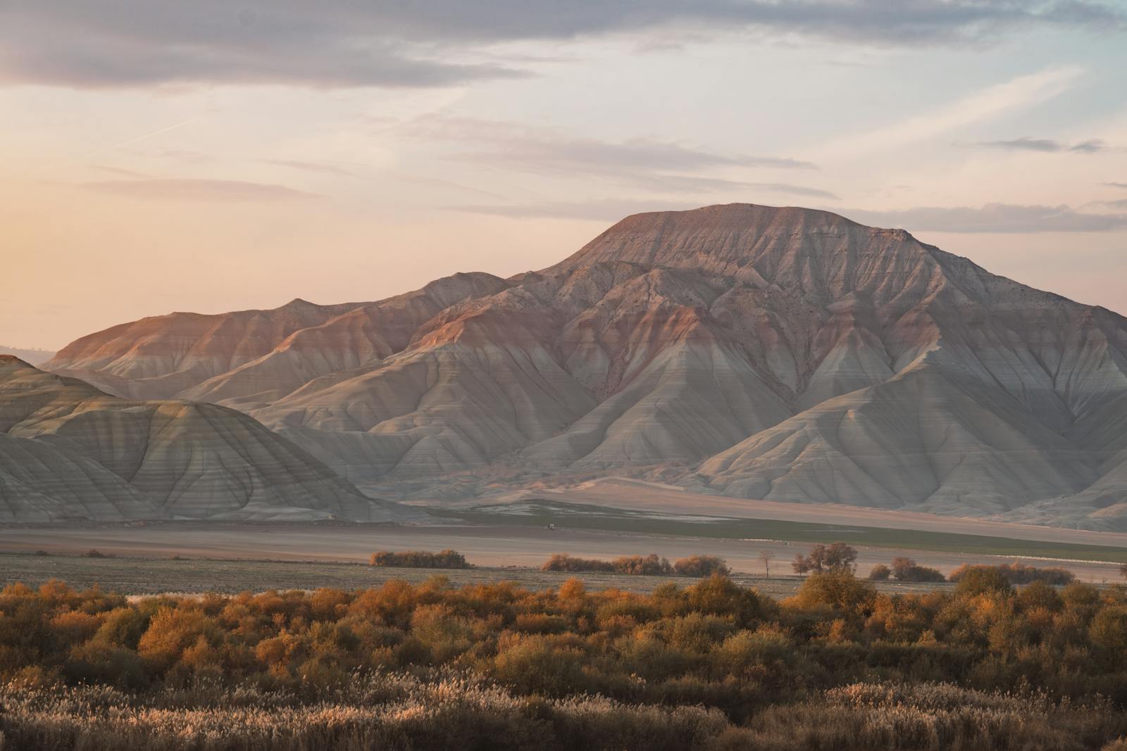 Beautiful mountain scene with sunset hues and calm nature setting.