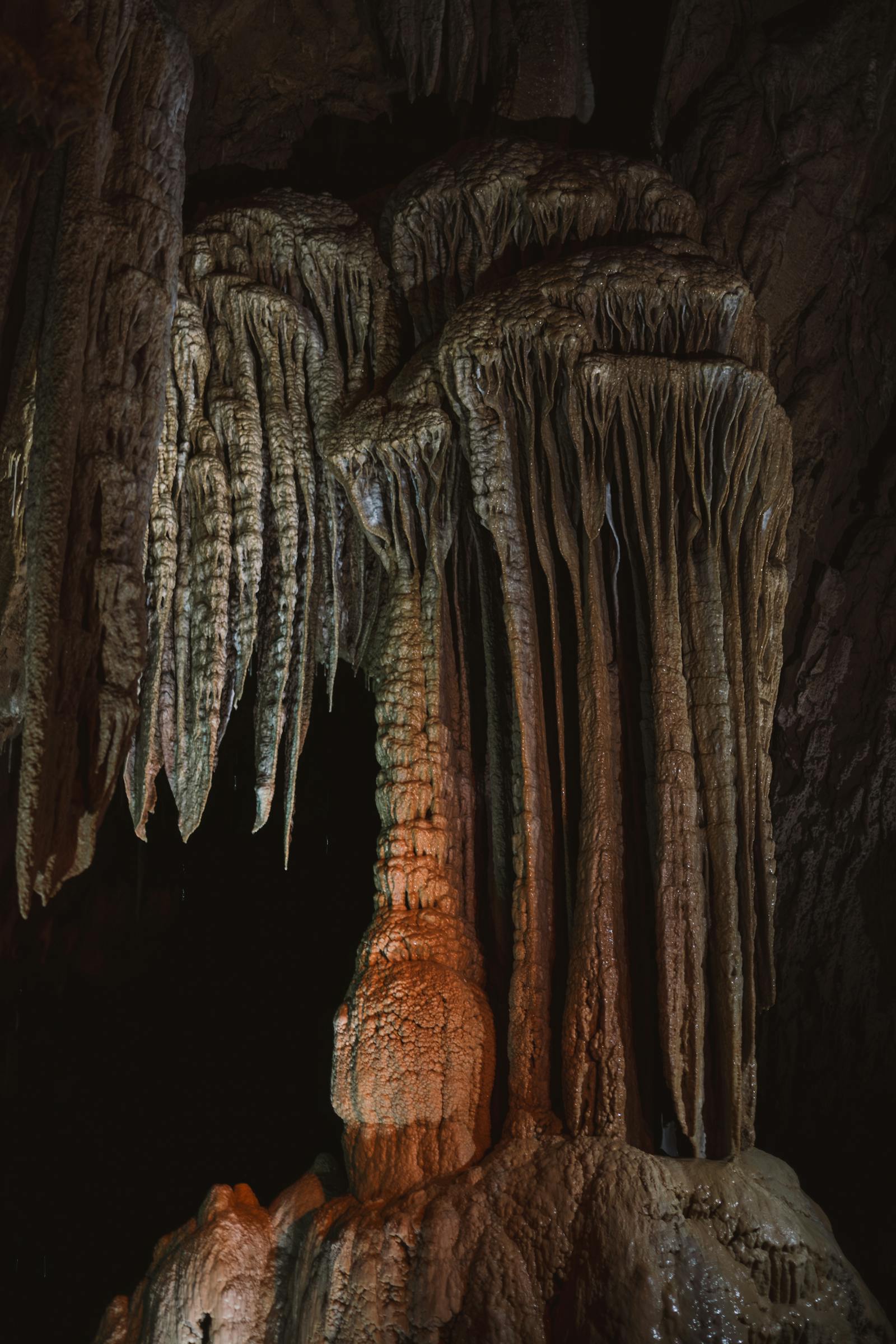 Majestic stalactites and stalagmites create a captivating scene inside Lurgrotte Cave, Austria.