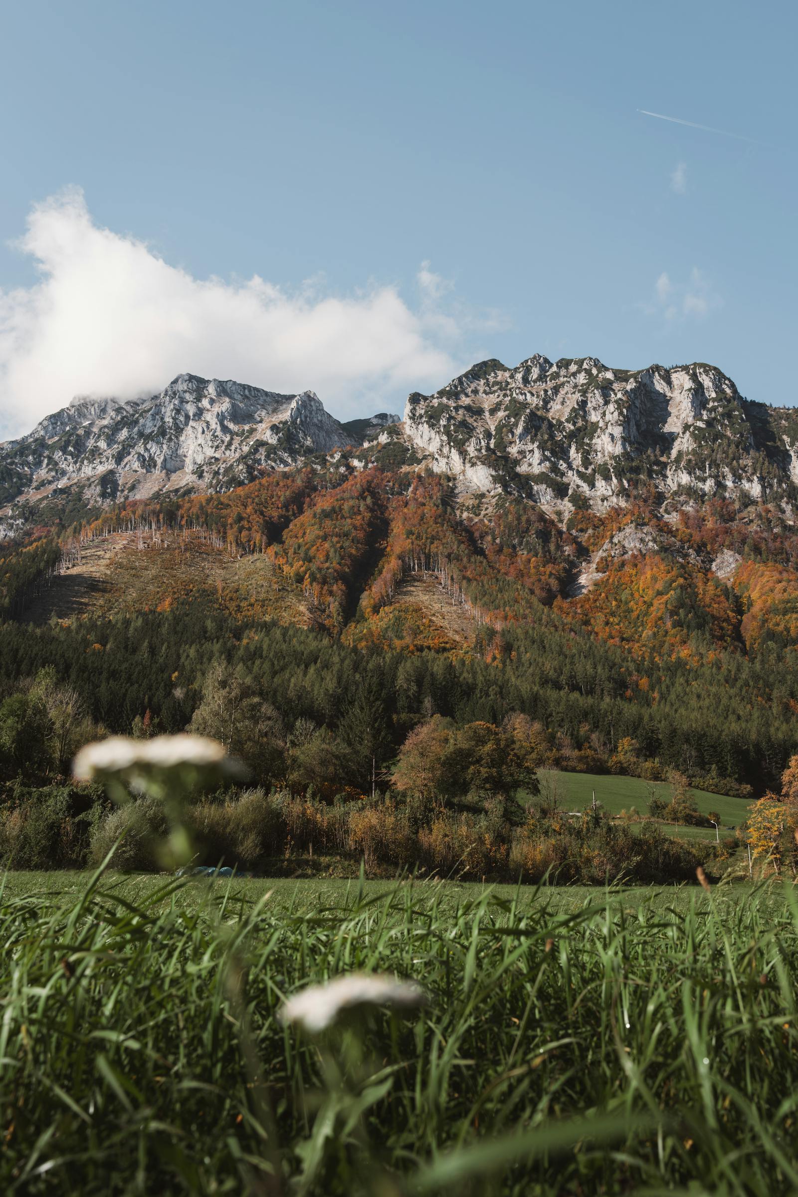 Scenic autumn view of the mountains in Eisenerz, Austria, with vibrant fall foliage.