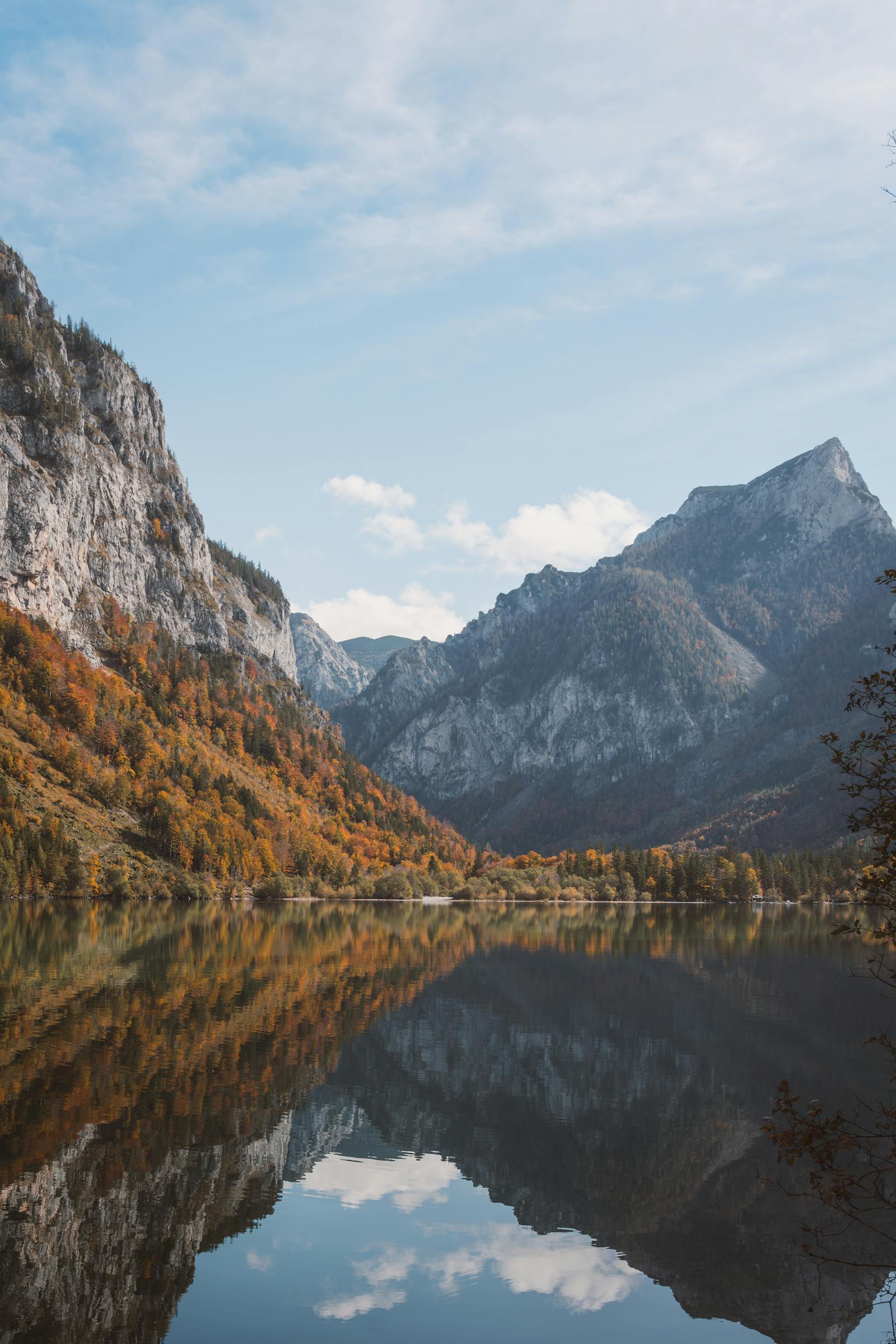 Scenic autumn view of mountain lake reflecting the Alps in Eisenerz, Austria.