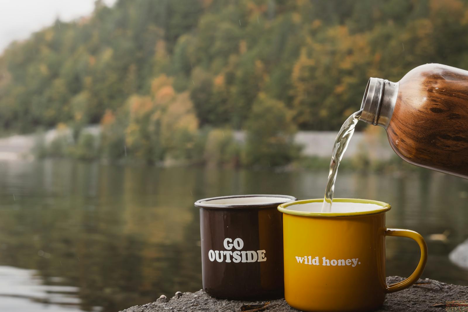 Serene lake view with mugs inviting adventure and nature at Bad Aussee, Austria.