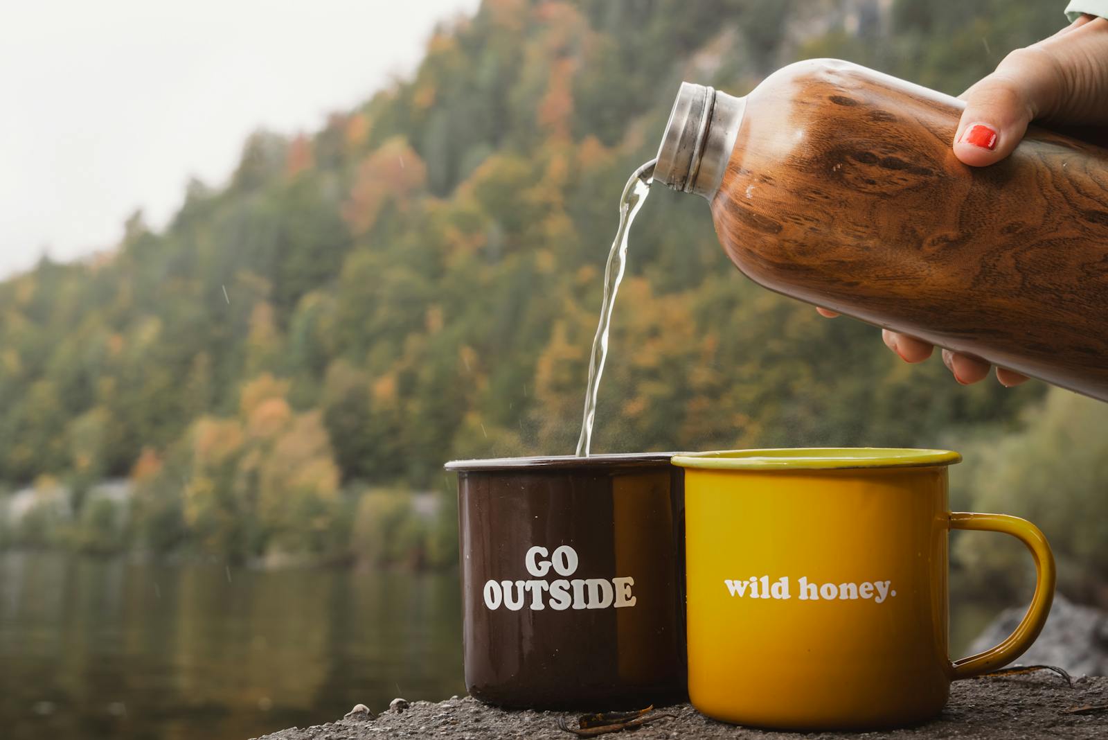 Enjoy a peaceful escape with mugs by a scenic Austrian lake in fall.