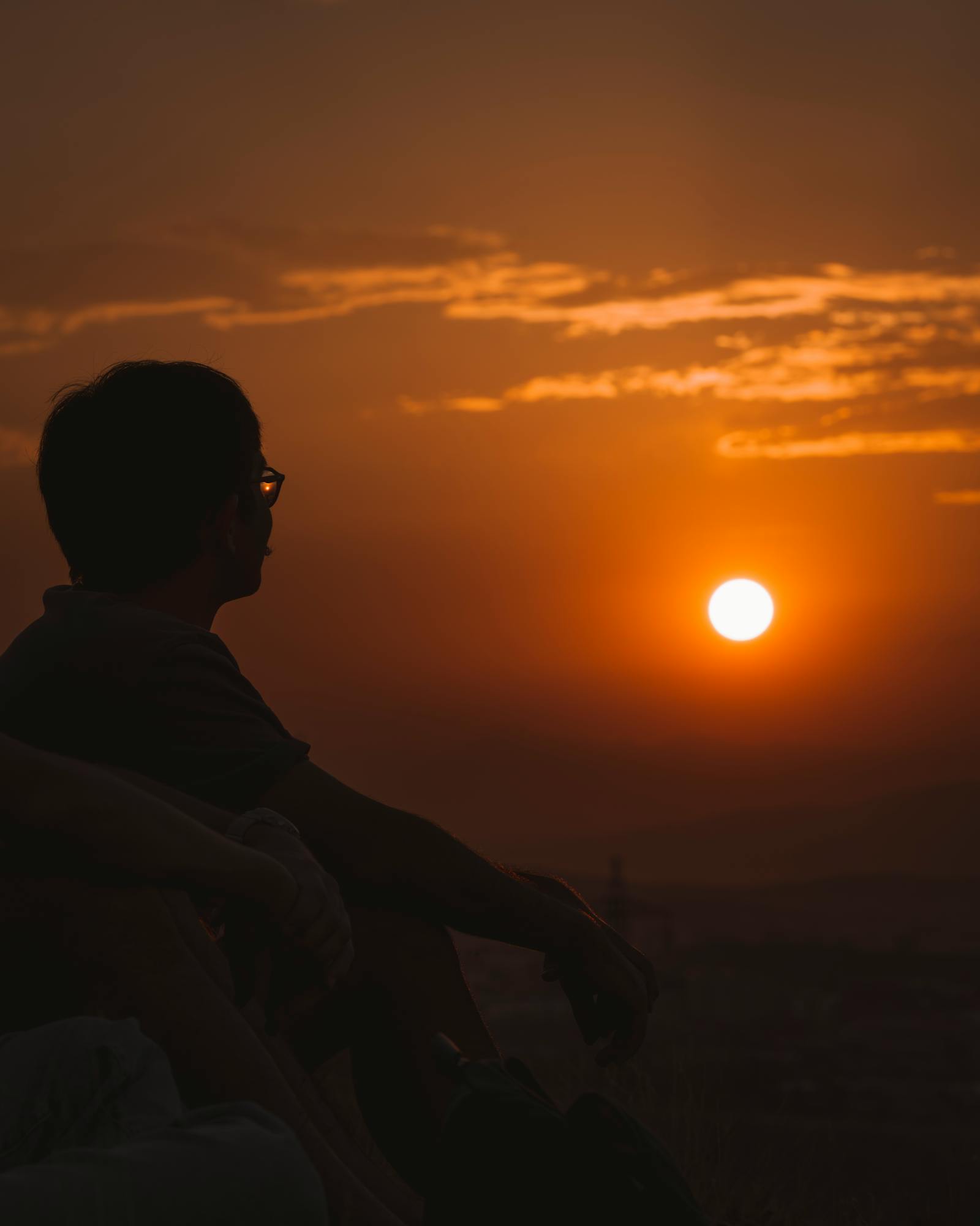 A tranquil silhouette of a person at sunset in Ankara, capturing a peaceful and reflective moment.