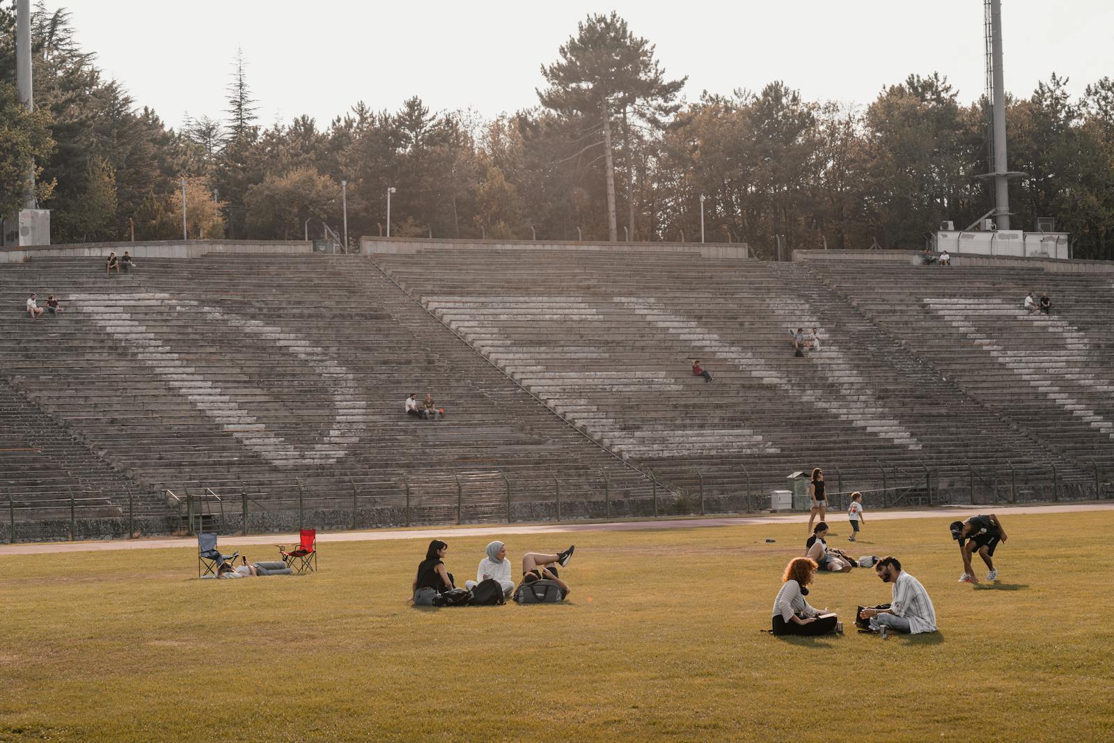 People enjoying leisure time at an outdoor stadium in Ankara, Türkiye.