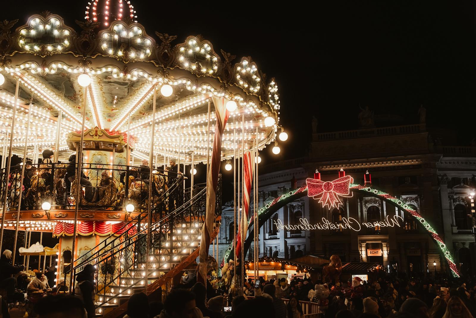 festive night at a christmas market with carousel