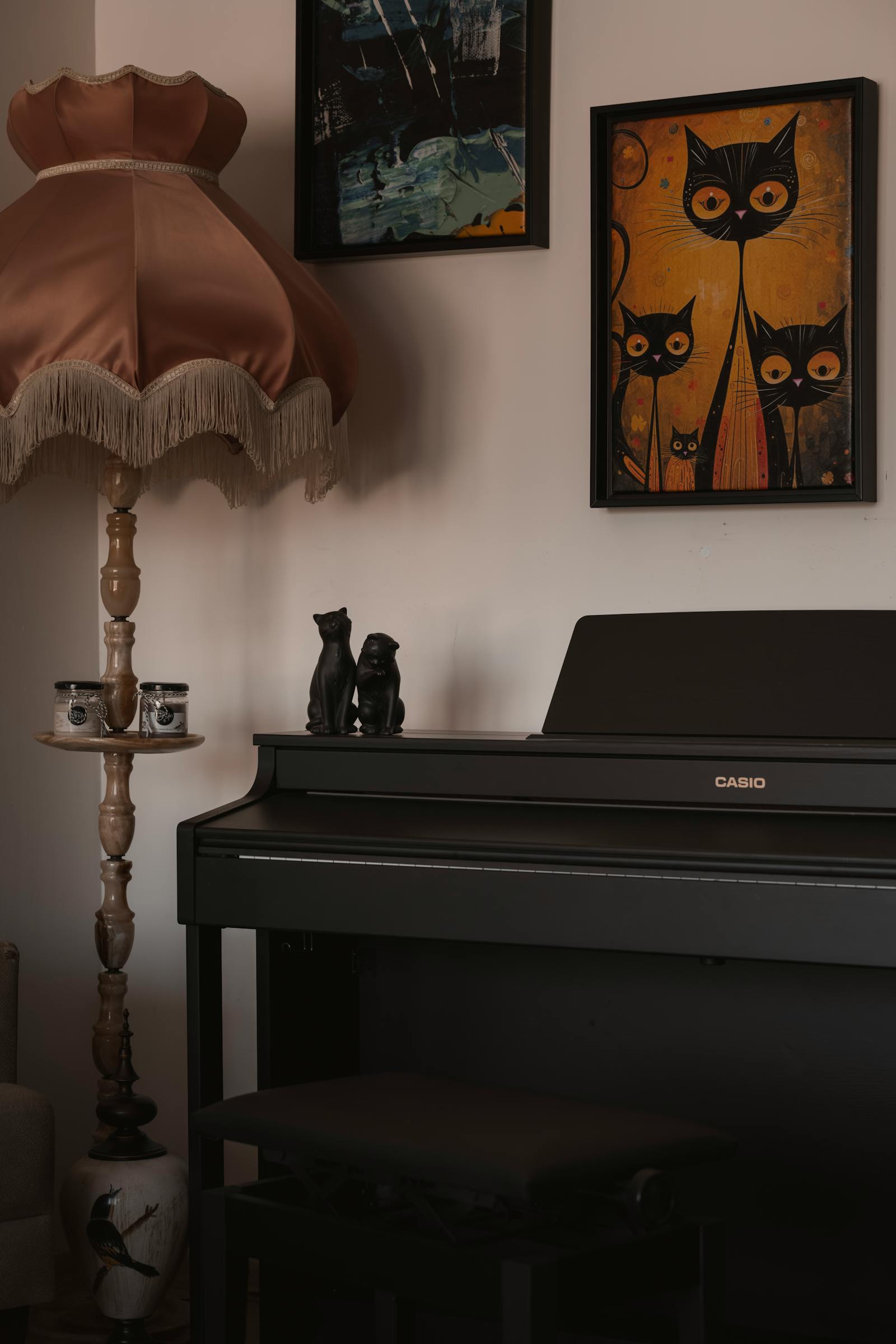 Warm-lit room featuring a vintage piano, art, and cozy decor in Ankara, Türkiye.