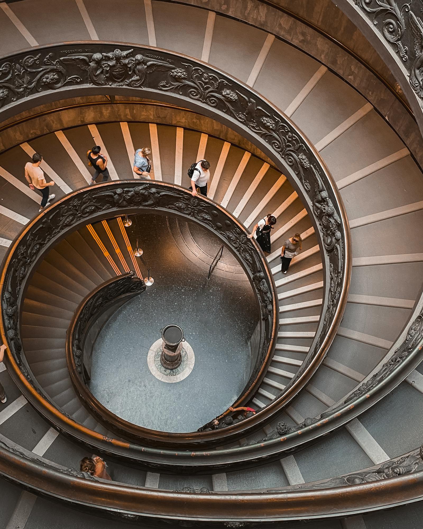 A captivating spiral staircase in the Vatican Museum, showcasing Renaissance architecture with a grand design.