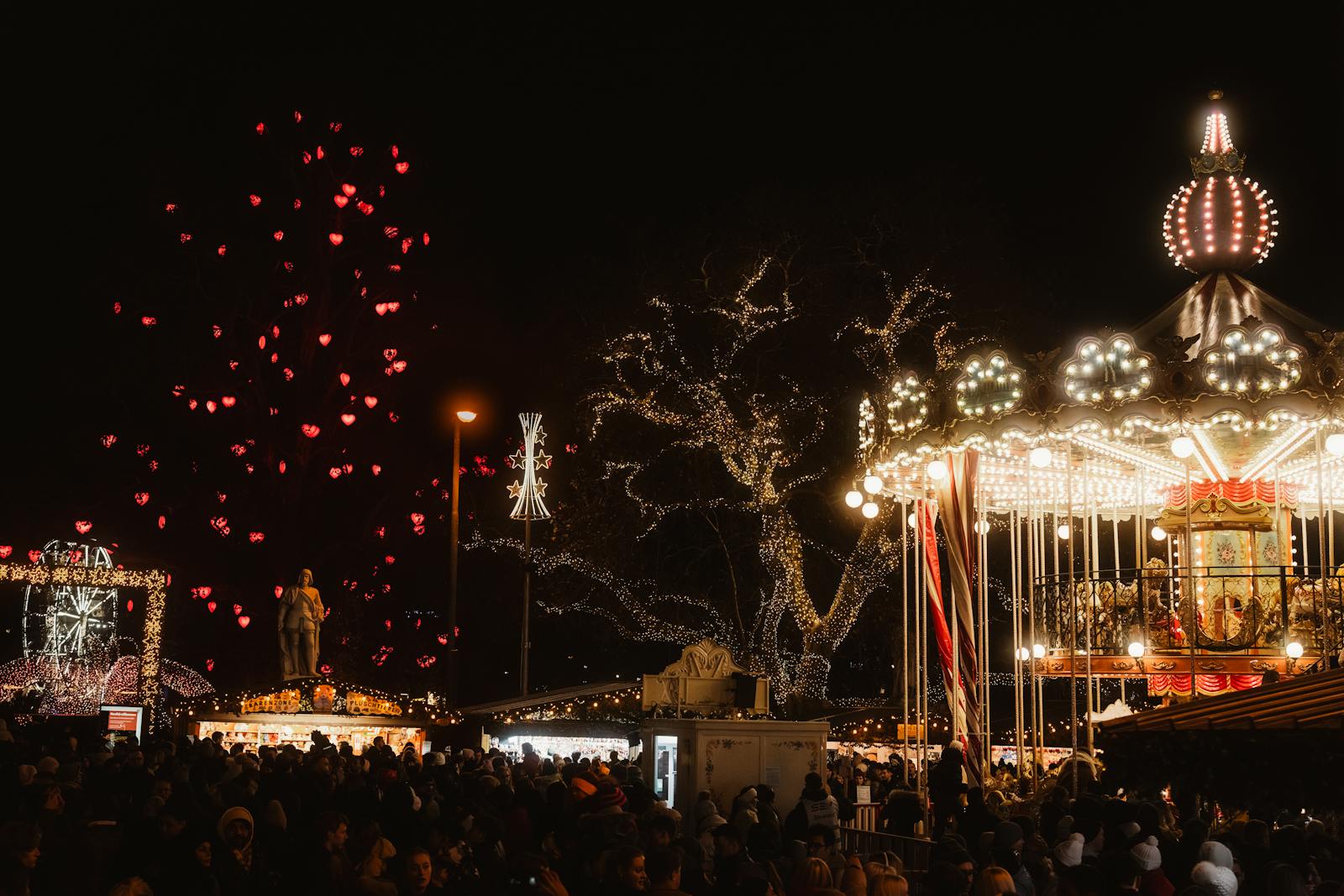 festive night at a christmas market with illuminated carousel