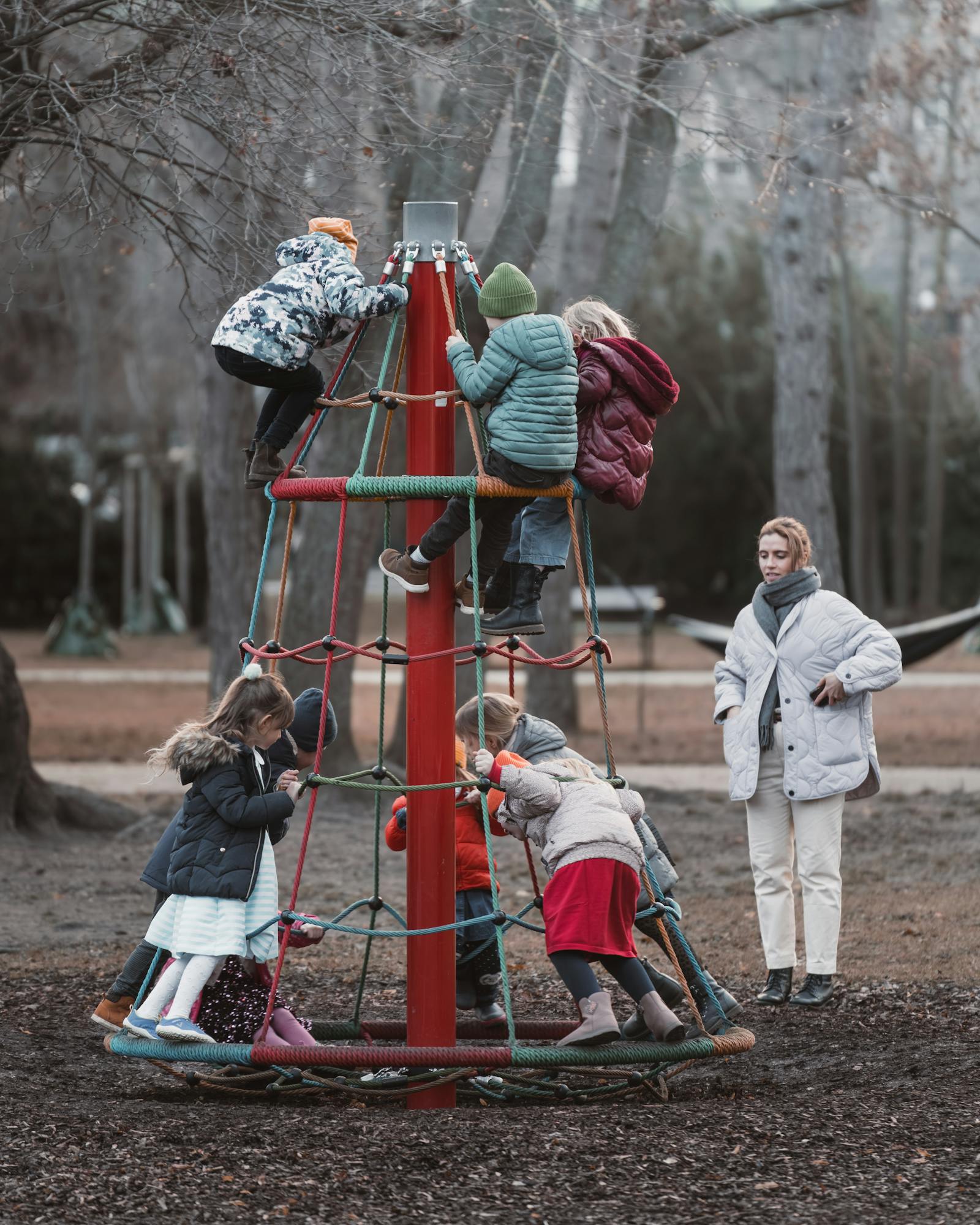 Group of children playing on a jungle gym in a park in Vienna, Austria.