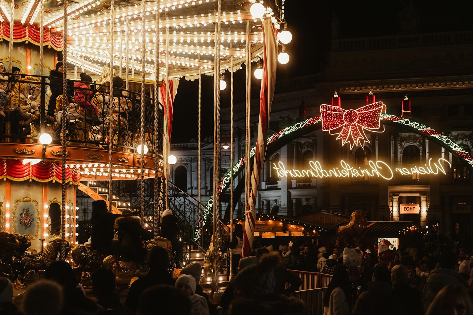 festive christmas market carousel at night