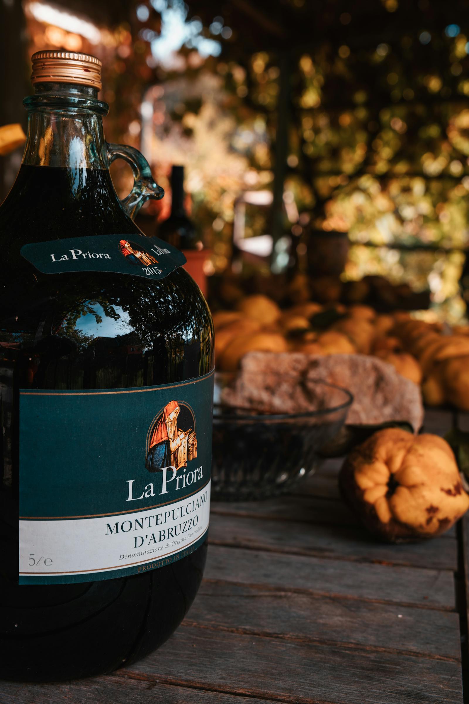 A rustic, autumn-themed setting featuring Montepulciano wine outdoors in Graz, capturing the essence of fall.