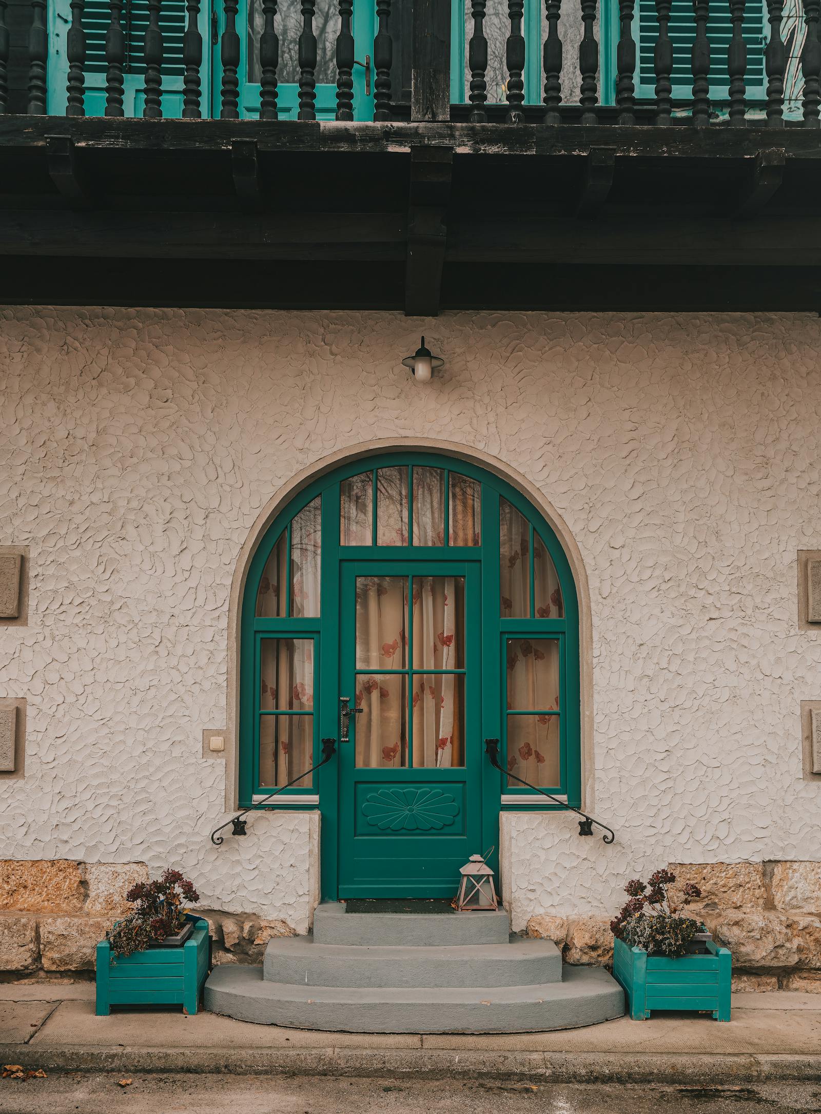 Inviting green doorway with vintage style in Graz, Austria, featuring a quaint facade.