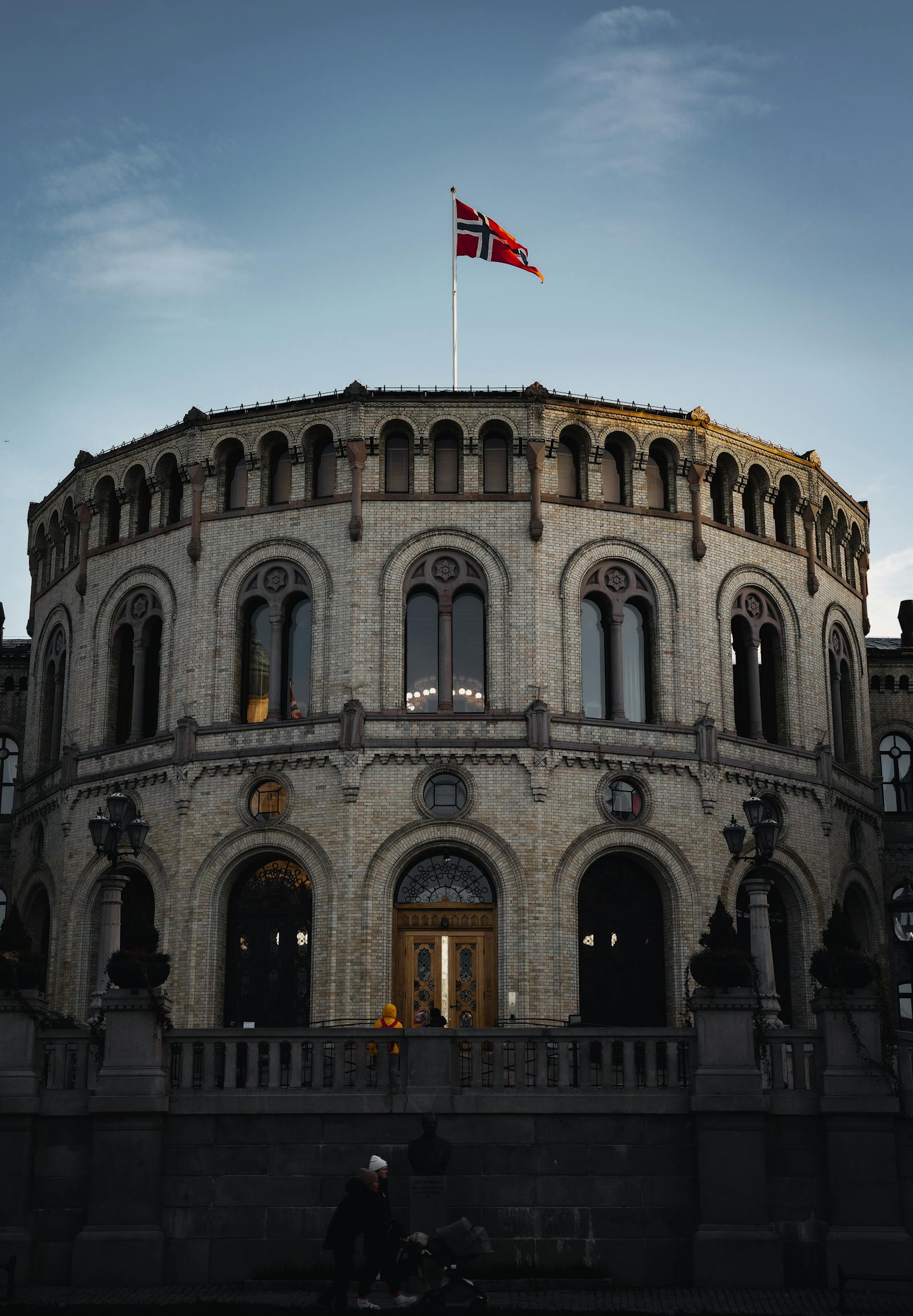 Storting building in Oslo at sunset, showcasing historical architecture.