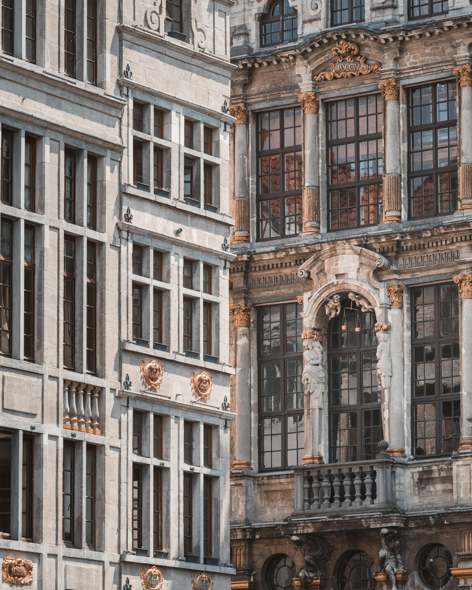 A detailed view of a historic Gothic facade in Brussels showcasing intricate architecture and craftsmanship.