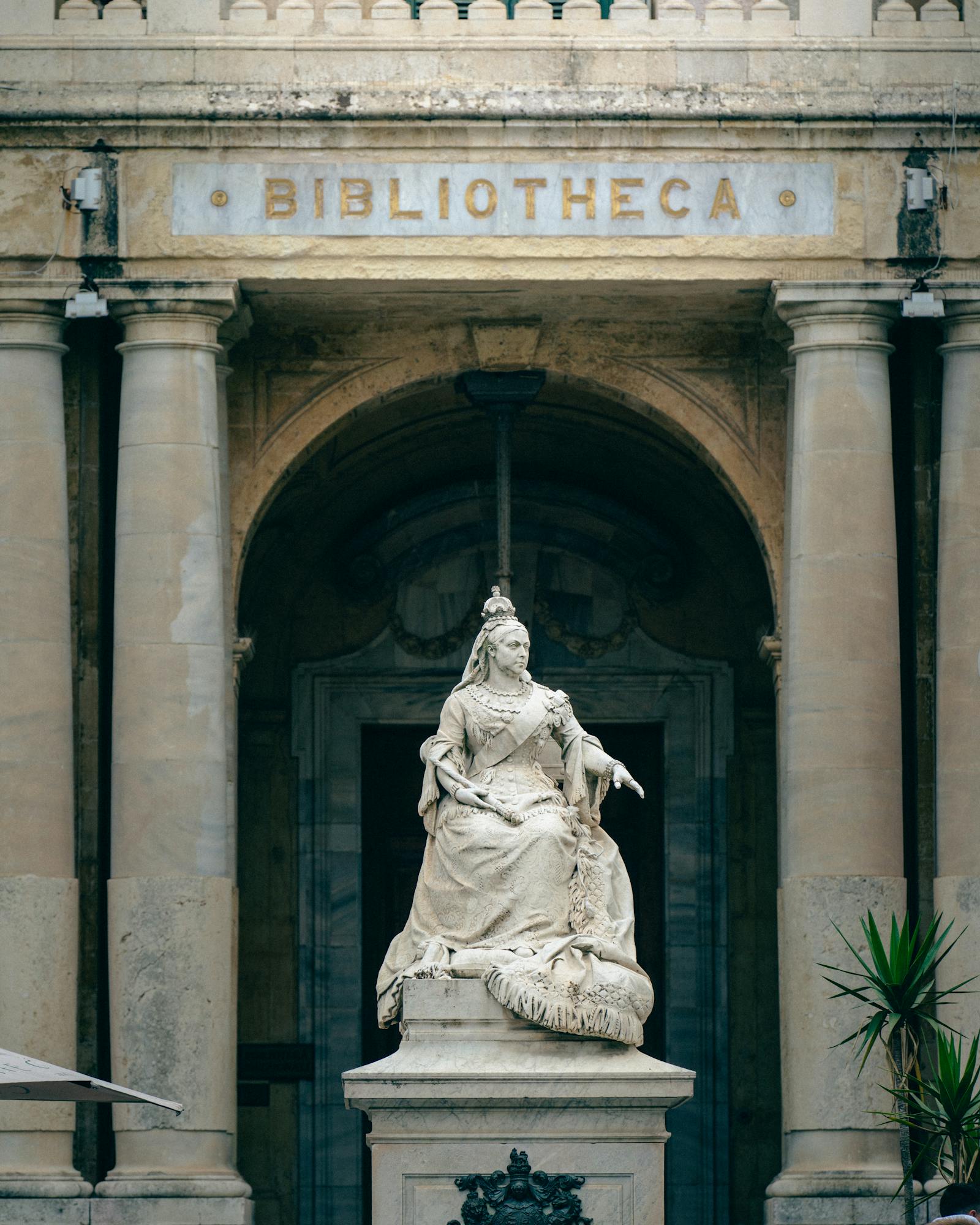 Marble statue of Queen Victoria at the entrance of the Bibliotheca in Valletta, Malta.