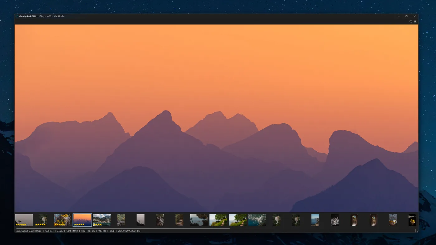 CoolGorilla showing a mountain sunset with the first four thumbnails carrying gold star ratings